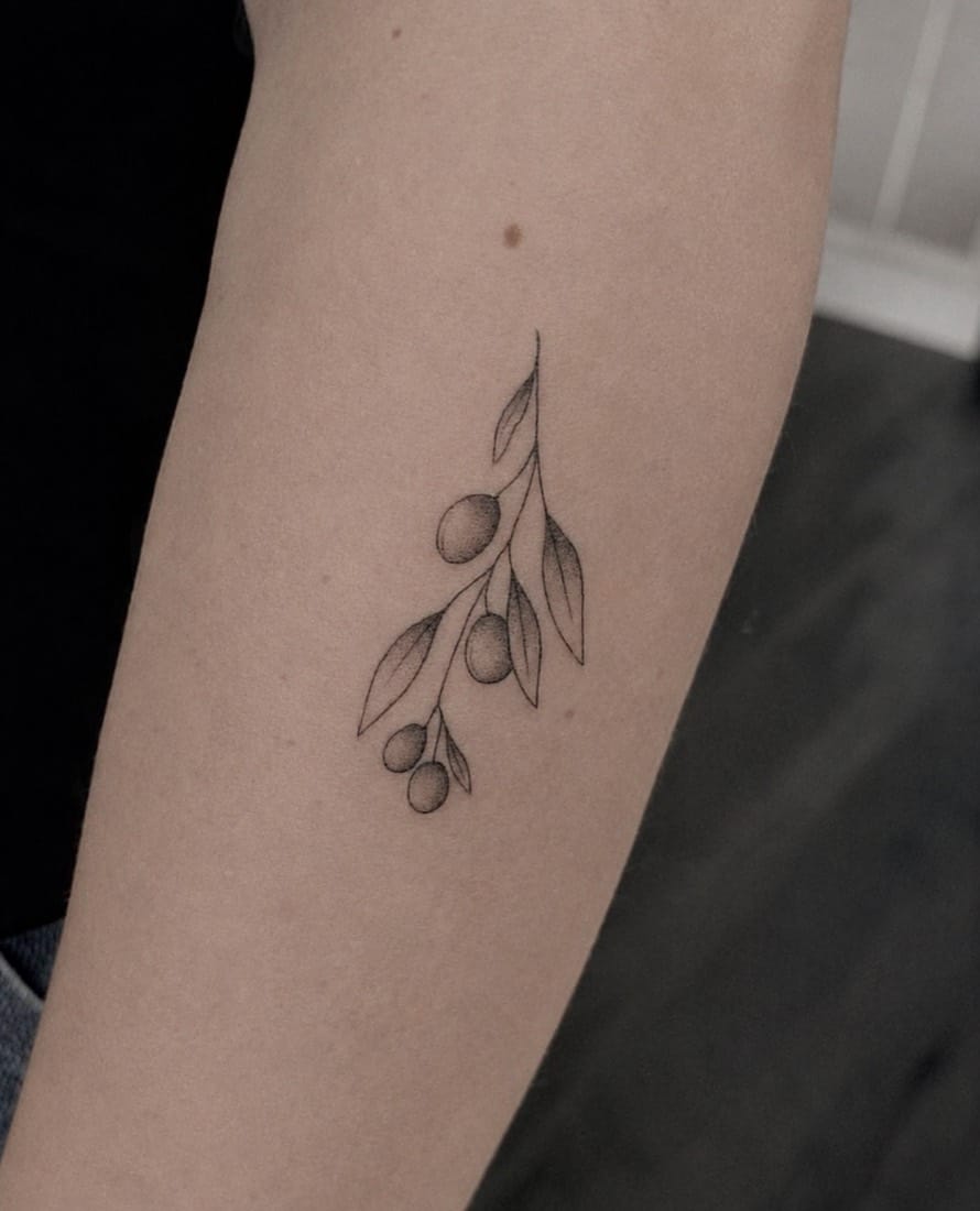 Fine line olive branch tattoo by a Manchester Fine Line Tattoo Academy student